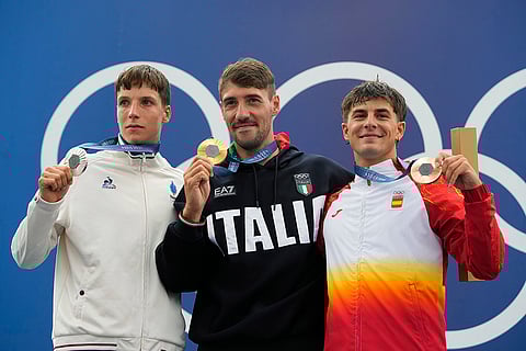 Men's kayak single finals medal ceremony: Silver medalist Titouan Castryck of France with Giovanni de Gennaro and Pau Echaniz